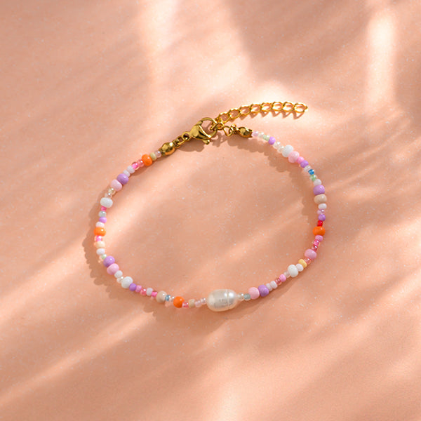 PERLENARMBAND rosa/lila inklusive gestreiftem STOFFBEUTEL mit gesticktem HERZ erhältlich bei www.luiseundfritz.de